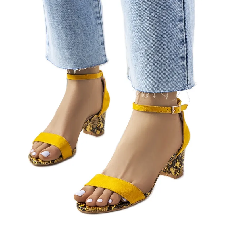 Yellow sandals on the post with the Azevedo snake motif