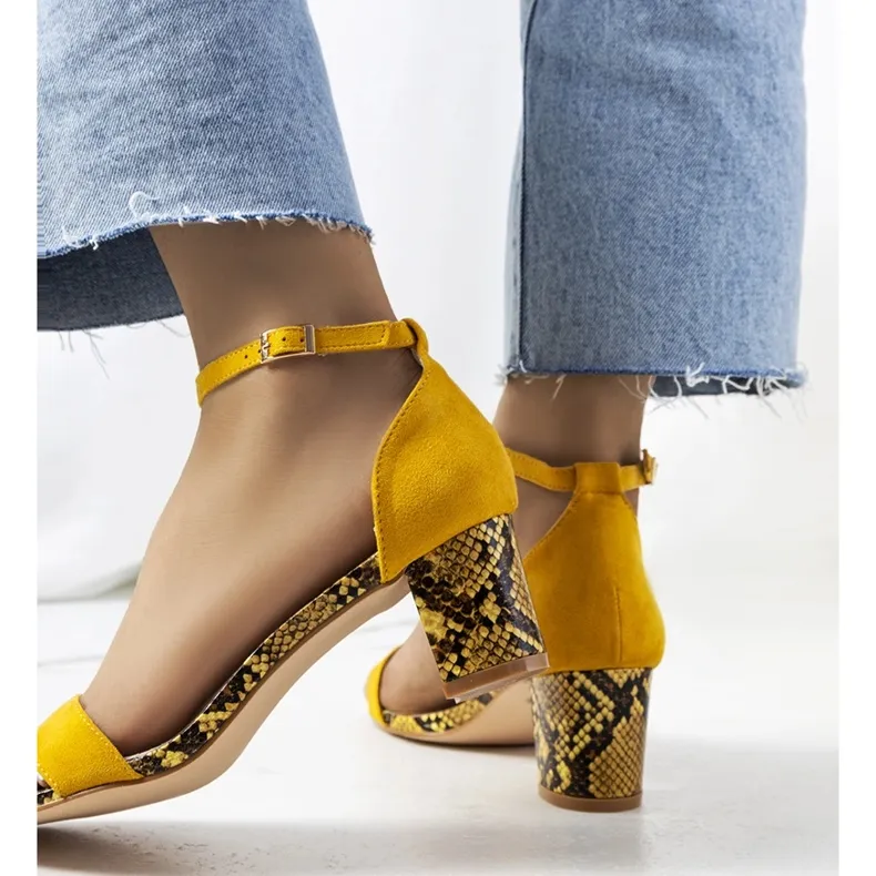 Yellow sandals on the post with the Azevedo snake motif