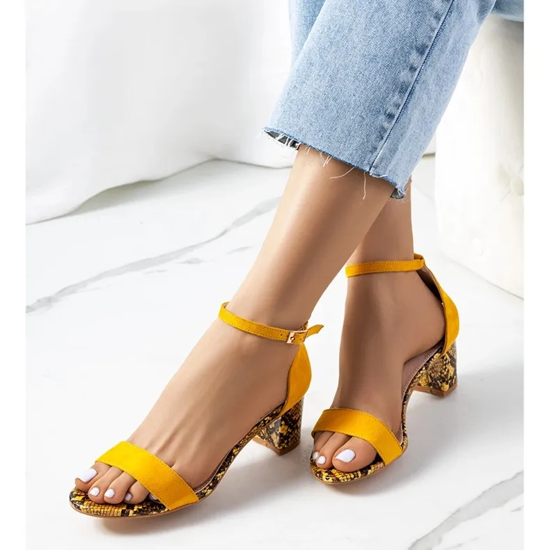 Yellow sandals on the post with the Azevedo snake motif